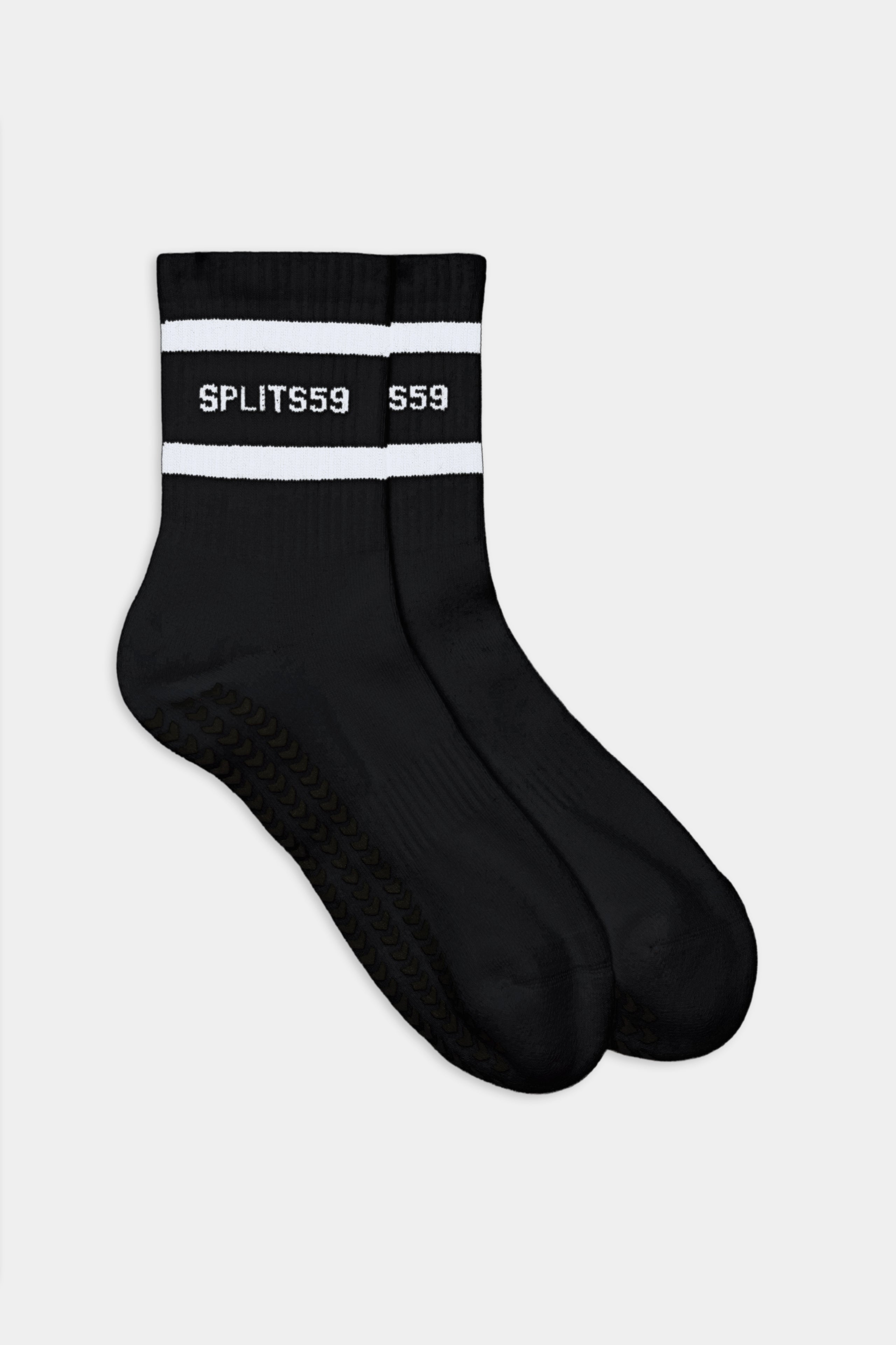 The SPLITS59 Logo Stripe Ankle Socks With Grip are black ankle socks featuring white stripes near the top and "SPLITS59" in white text.