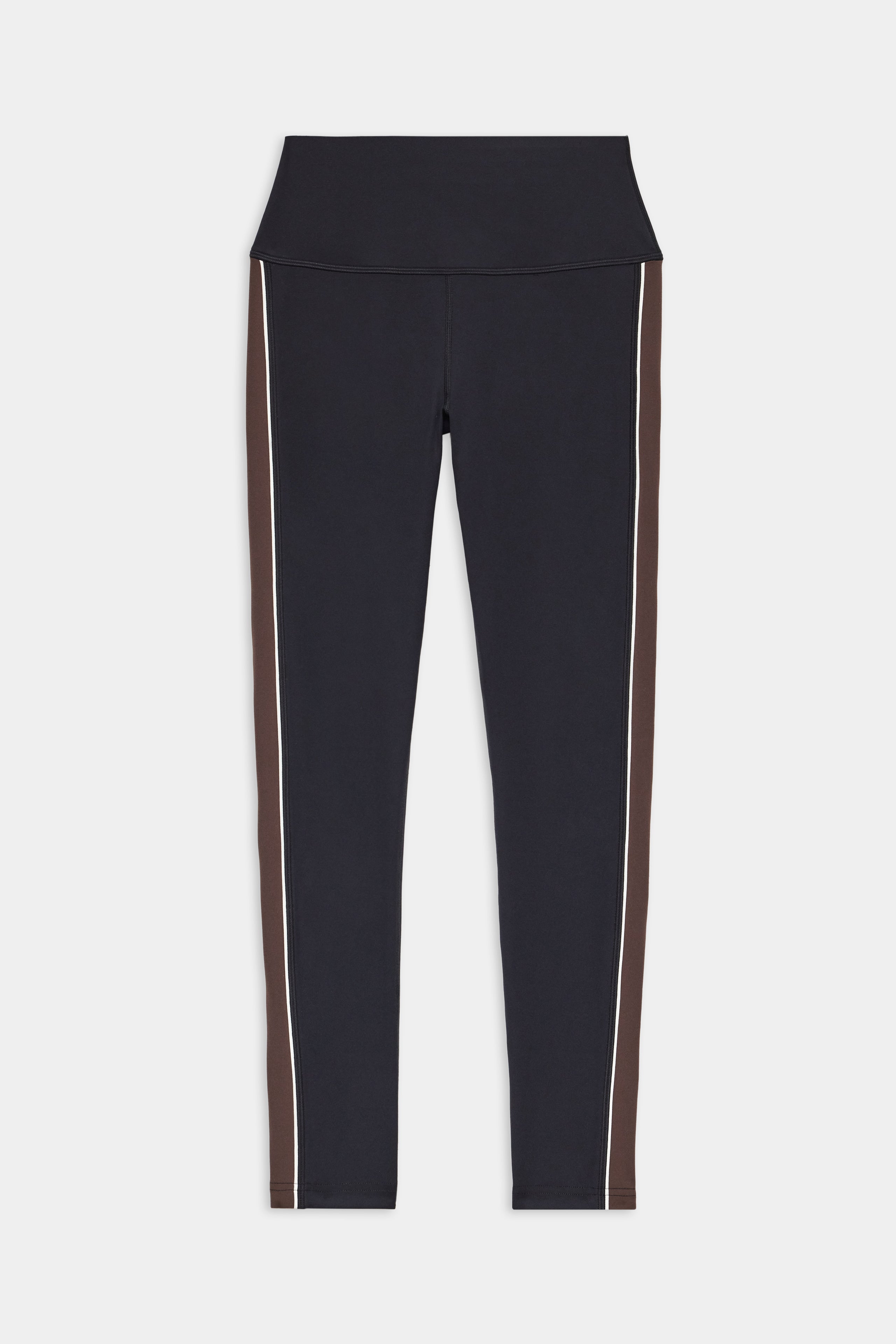The SPLITS59 Margot Rigor Legging - Black/Dark Chocolate features black leggings with a high waistband, dark chocolate side panels, and white piping along each leg, shown laid flat on a white background.