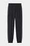The SPLITS59 Megan Woven Nylon Jogger w/ Piping in black/creme features an elastic waistband and cuffs, white piping down each leg, and is made from an 85% nylon blend. Shown on a plain white background.