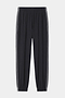 The SPLITS59 Megan Woven Nylon Jogger w/ Piping in black/creme features an elastic waistband and cuffs, white piping down each leg, and is made from an 85% nylon blend. Shown on a plain white background.