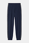 The SPLITS59 Megan Woven Nylon Jogger w/ Piping in Indigo/Creme features an elastic waistband and cuffs, white side piping, and is crafted from stretchy fabric for comfort and flexibility.