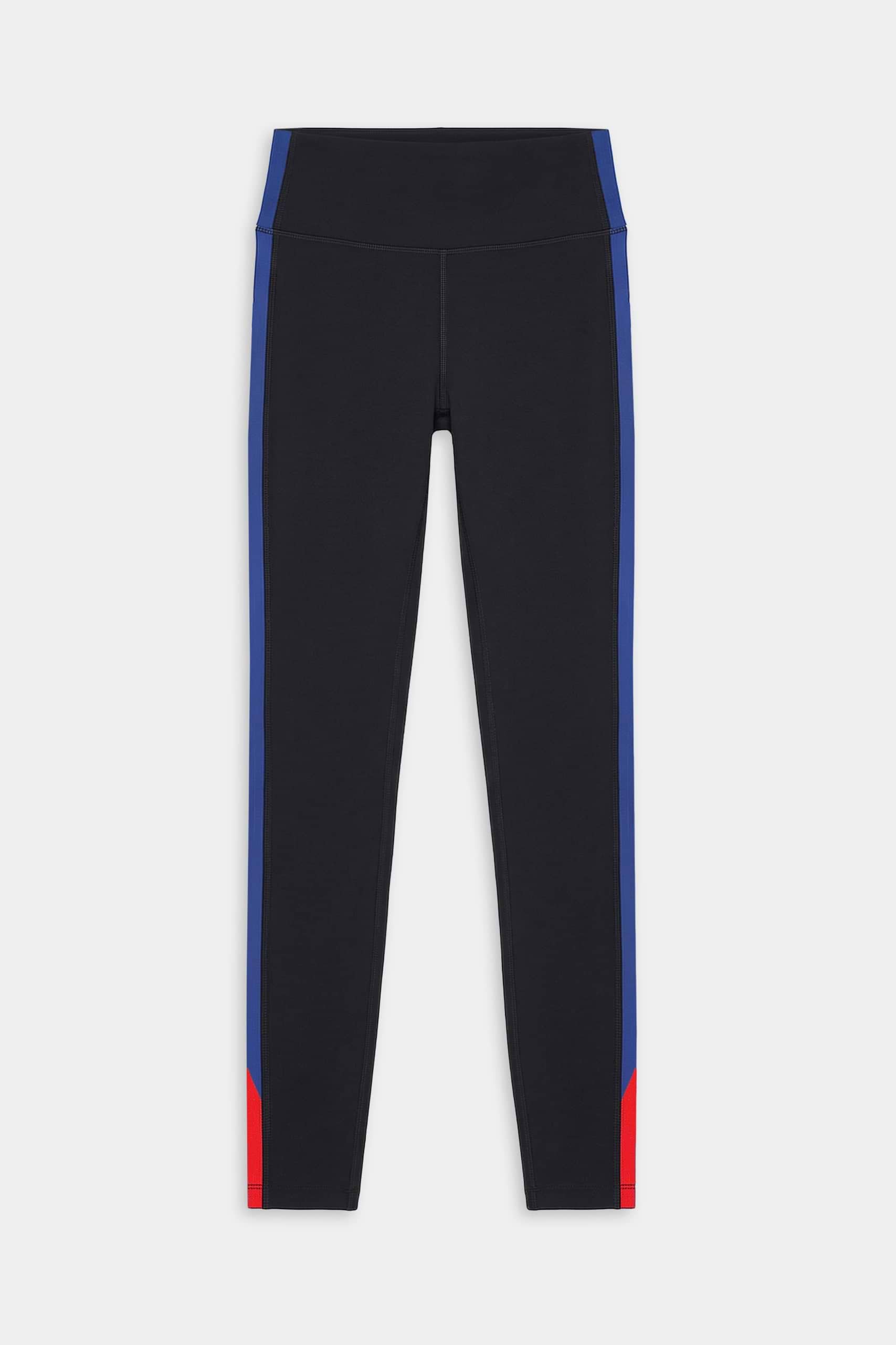 The SPLITS59 Monah High Waist Rigor Legging 7/8 in Black/Cobalt features blue side stripes and red lower leg accents on a nylon-spandex blend, showcased against a plain white background.