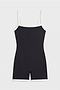 The SPLITS59 Monah Rigor Jumpsuit - Black/White is a sleeveless one-piece with white trim and a supportive fit, shown flat on a white background.