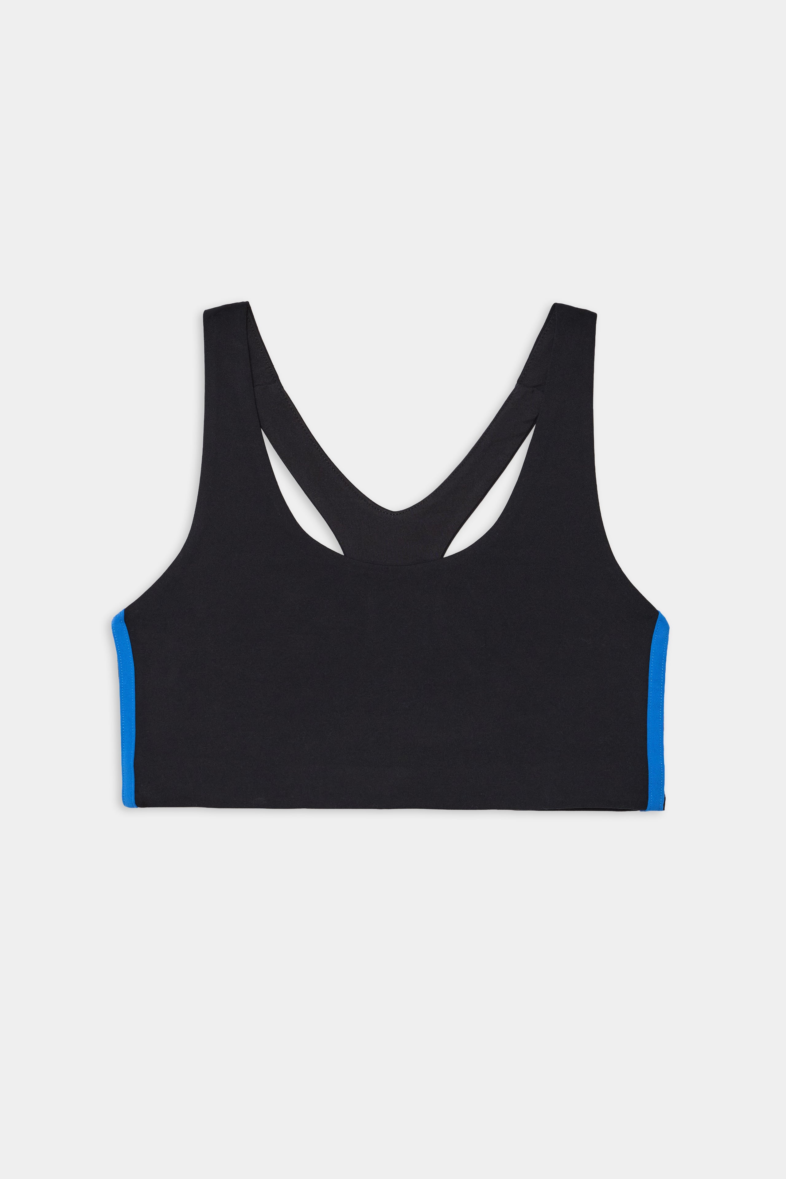 The SPLITS59 Ella Airweight Bra in Black/Classic Blue features a racerback design and blue side panels, made from stretchy nylon spandex, shown against a white background.