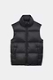The SPLITS59 Summit Nylon Puffer Vest in black is a sleeveless, lightweight insulated vest with a front zipper and two side pockets, ideal for cool weather workouts. Shown on a plain white background.