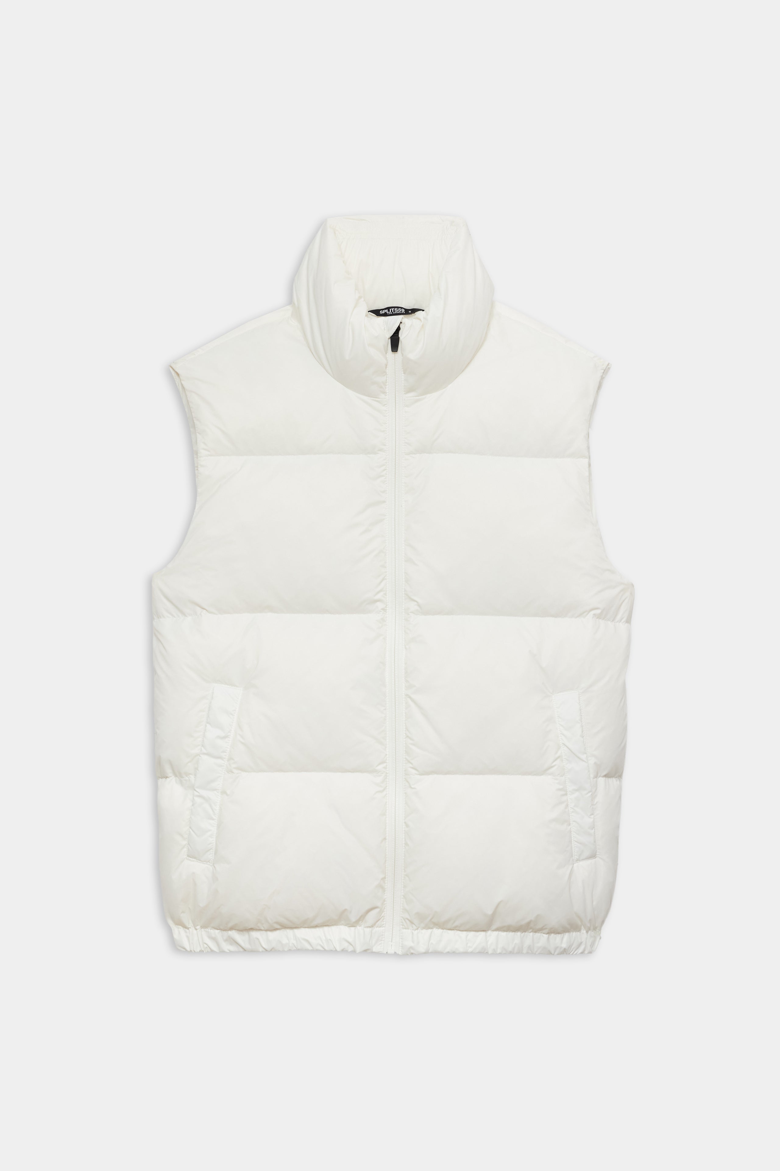 The SPLITS59 Summit Nylon Puffer Vest in white features a sleeveless design, high collar, front zipper closure, and two side pockets for lightweight insulation—ideal for cool weather workouts. Shown laid flat on a white background.