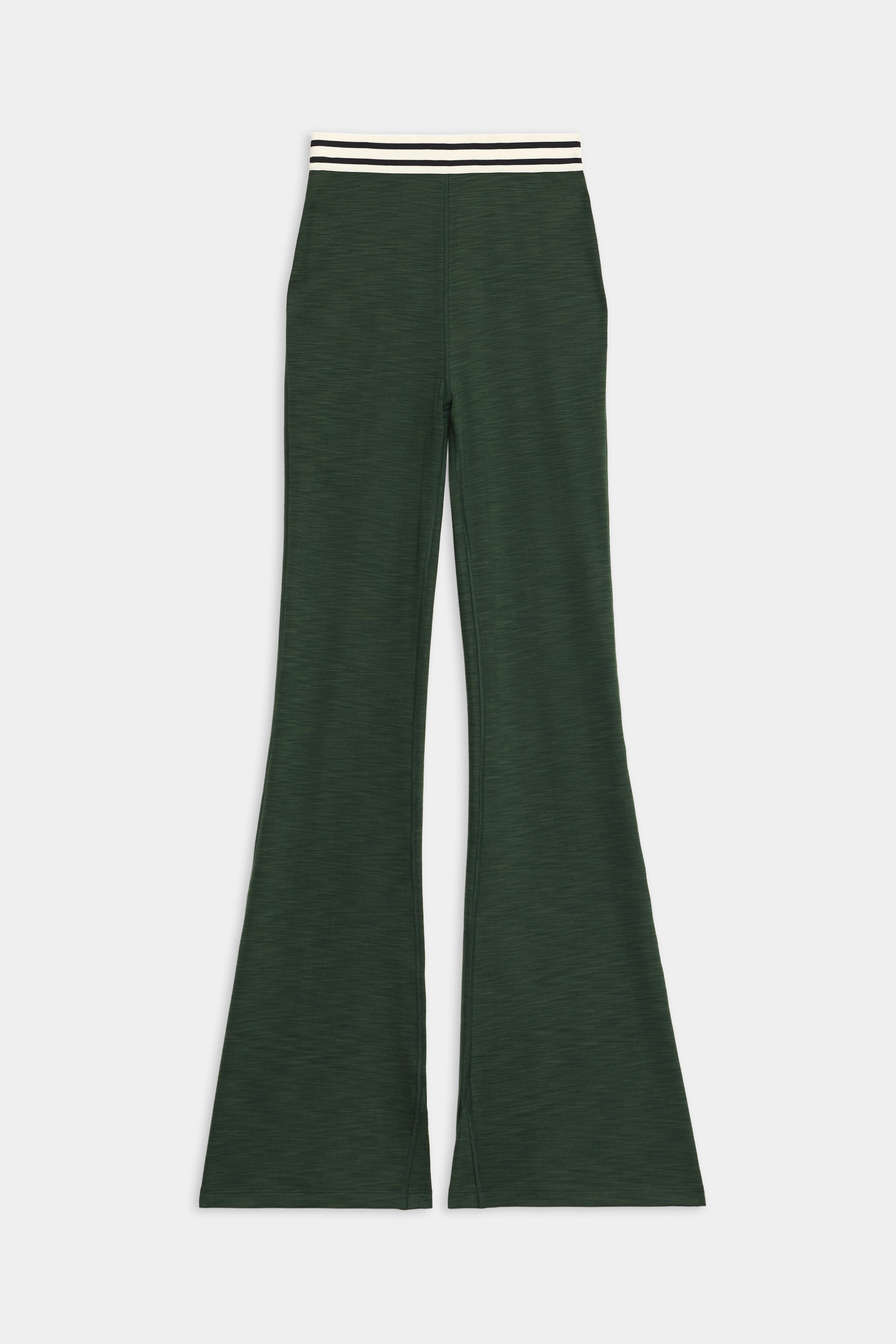 The SPLITS59 Raquel Active Rib Flare features dark green flared legs and a white and black striped elastic waistband, shown against a plain white background.