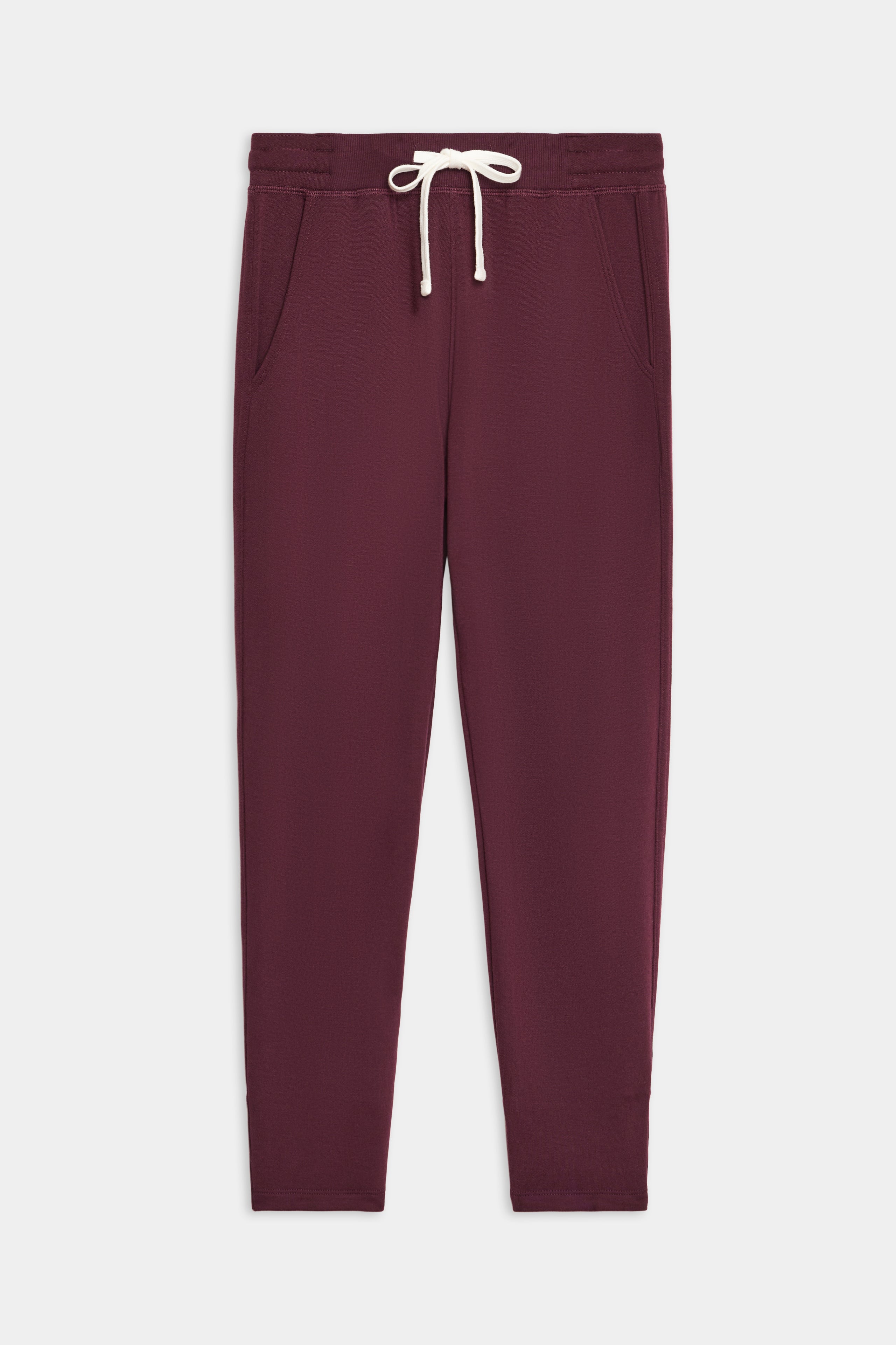 The SPLITS59 Reena Fleece 7/8 Sweatpant, in maroon with side pockets and a white drawstring waistband, is displayed flat on a white background.