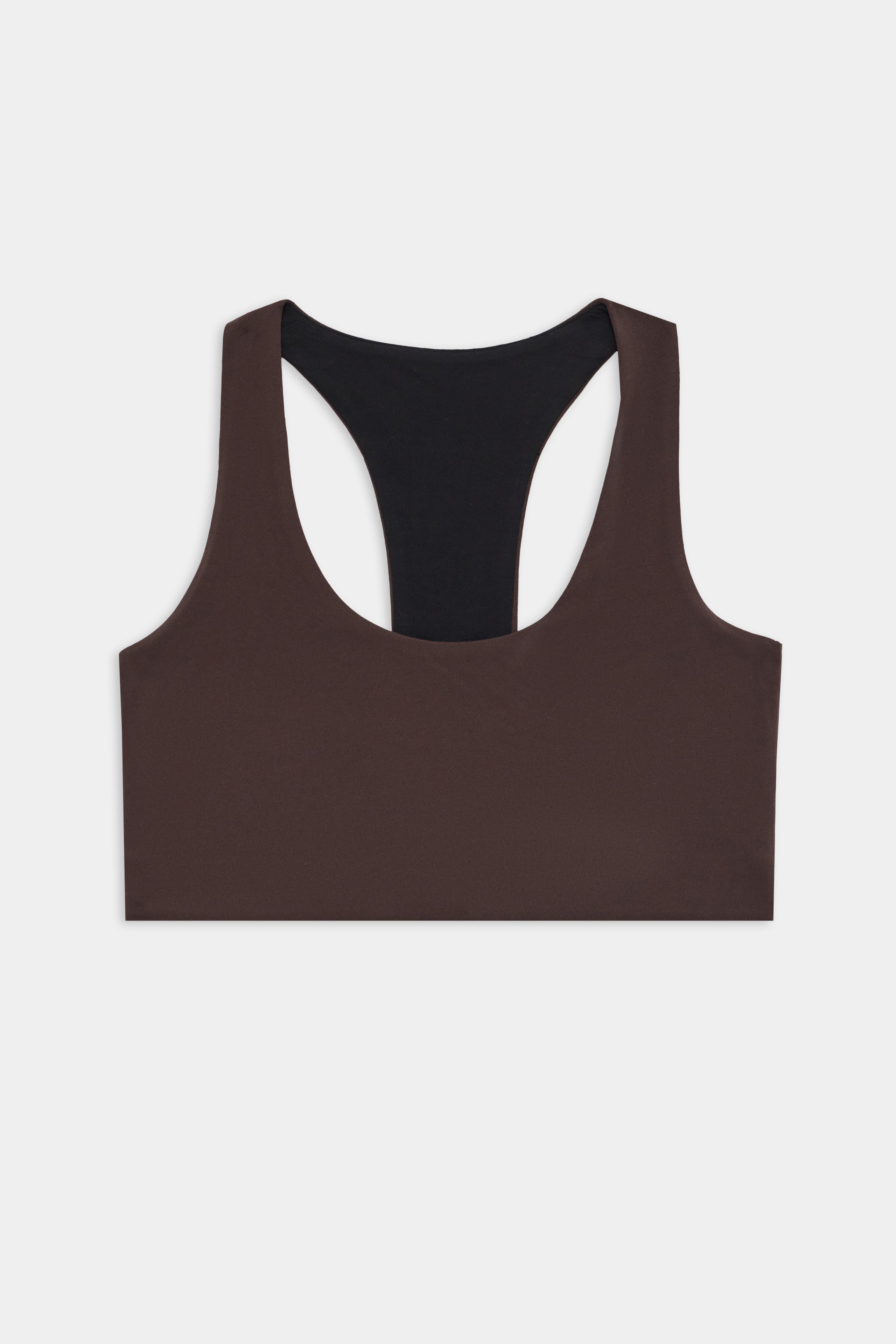 The SPLITS59 Sara Airweight Bra in Dark Chocolate, featuring a racerback and black inner lining, is perfect for Pilates or hot yoga and is shown flat against a white background.