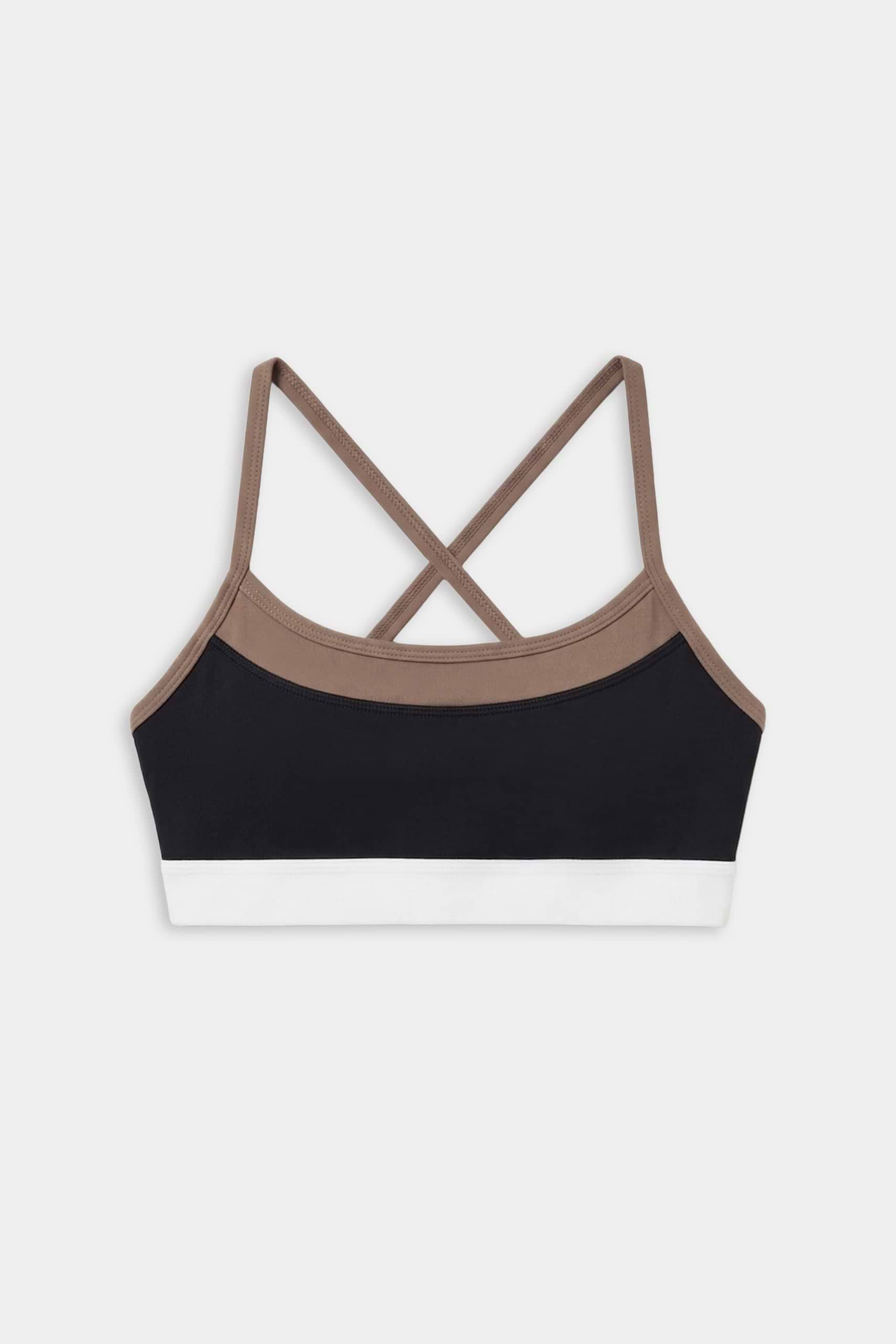 The SPLITS59 Scottie Airweight Bra - Black/Lentil features a color-blocked design with brown straps, a black front panel, and a white bottom band in soft nylon-spandex blend, shown on a white background.