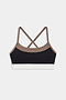 The SPLITS59 Scottie Airweight Bra - Black/Lentil features a color-blocked design with brown straps, a black front panel, and a white bottom band in soft nylon-spandex blend, shown on a white background.
