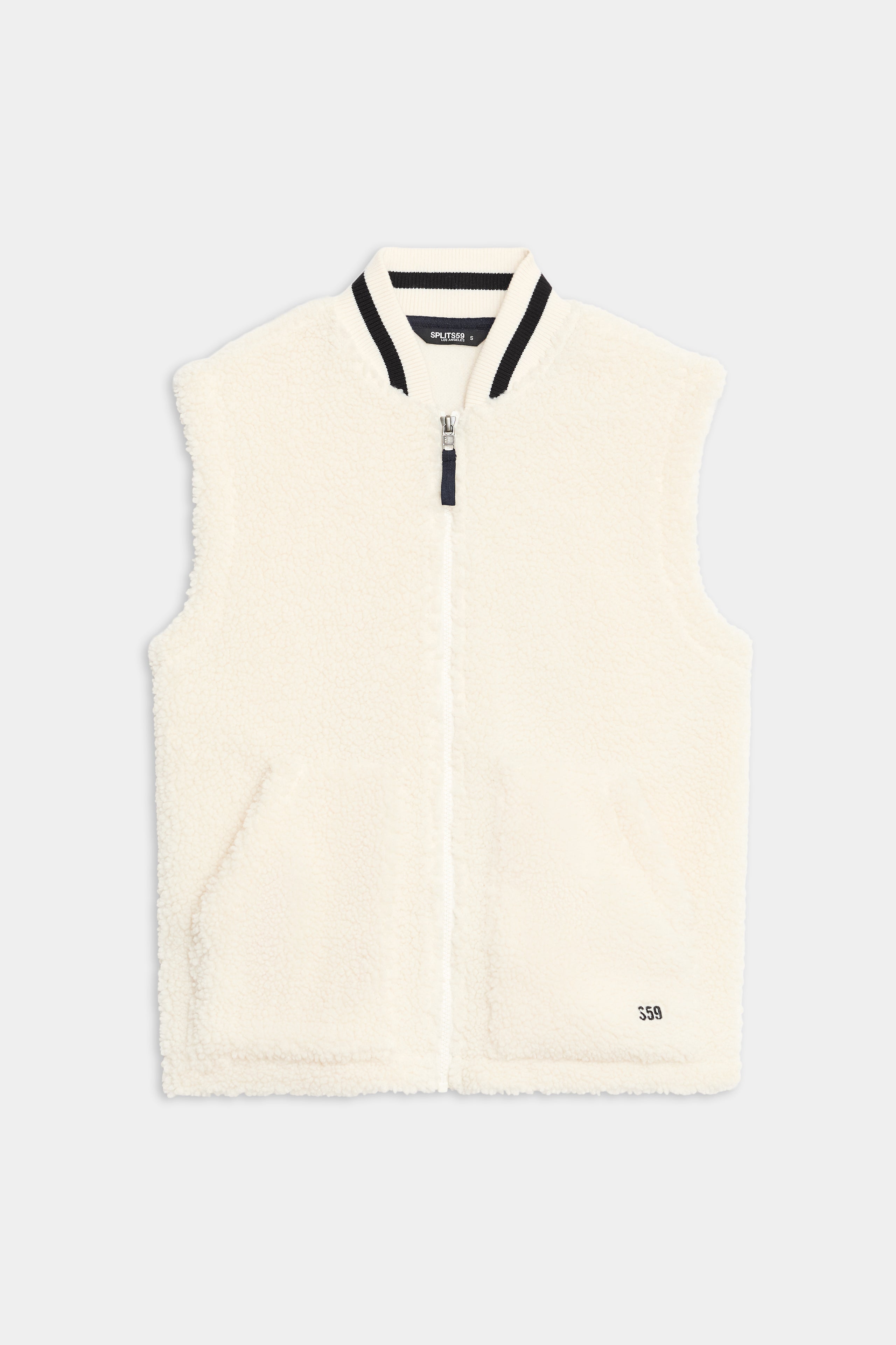 The SPLITS59 Aster Sherpa Vest is a sleeveless white fleece vest with a front zipper, ribbed collar, two front pockets, and "550" text near the hem.