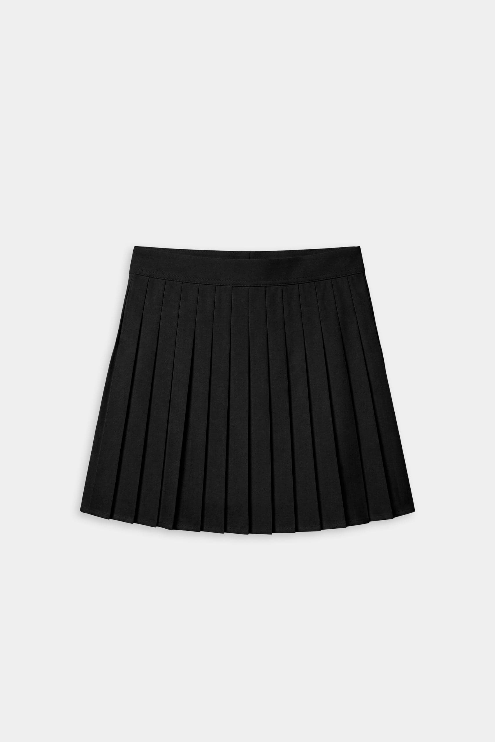 The SPLITS59 Shira Woven Pleated Skort in black is shown against a plain light gray background, ideal for court sports or gym workouts.