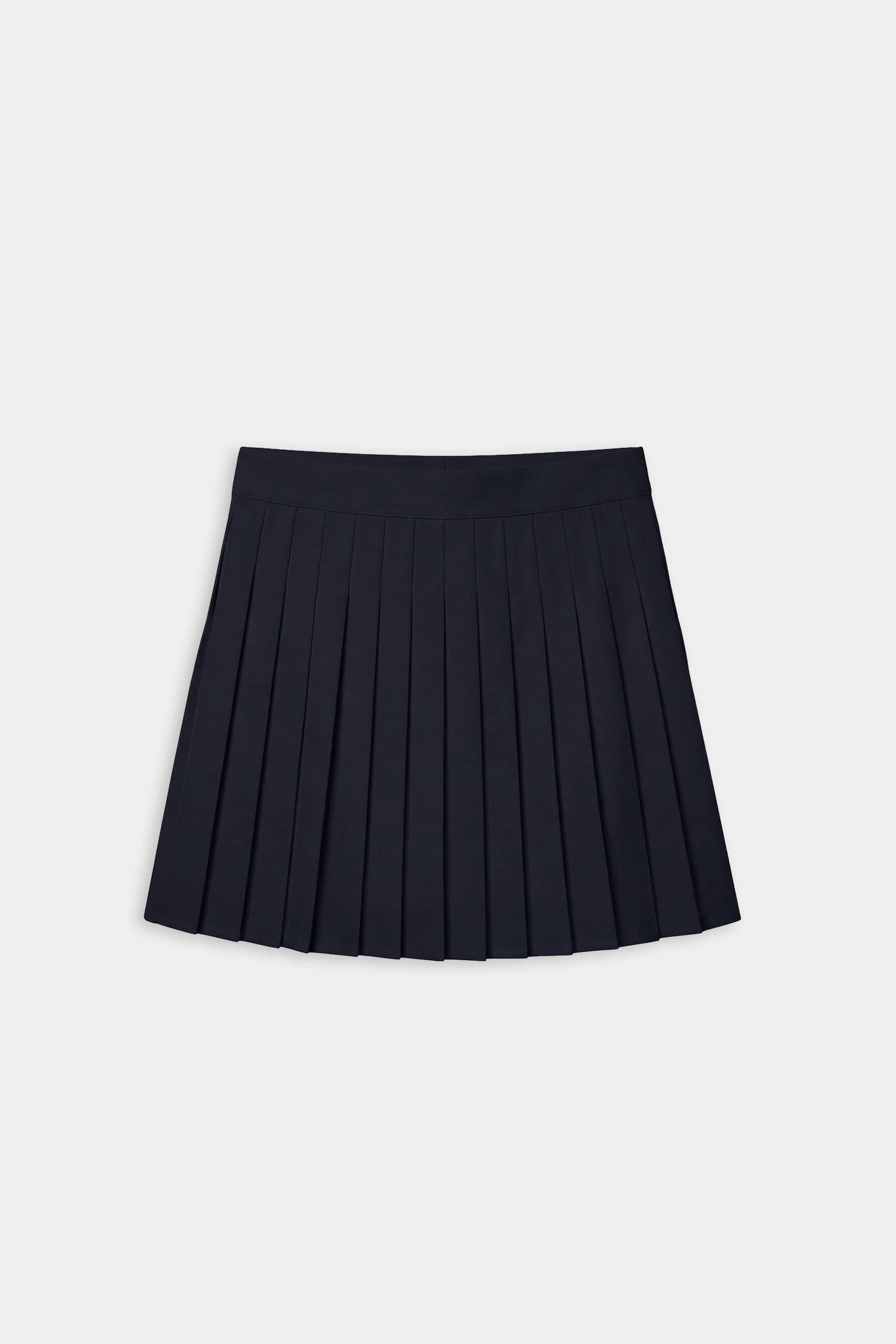 The SPLITS59 Shira Woven Pleated Skort in Indigo, ideal for court sports or gym workouts, is shown against a plain white background.