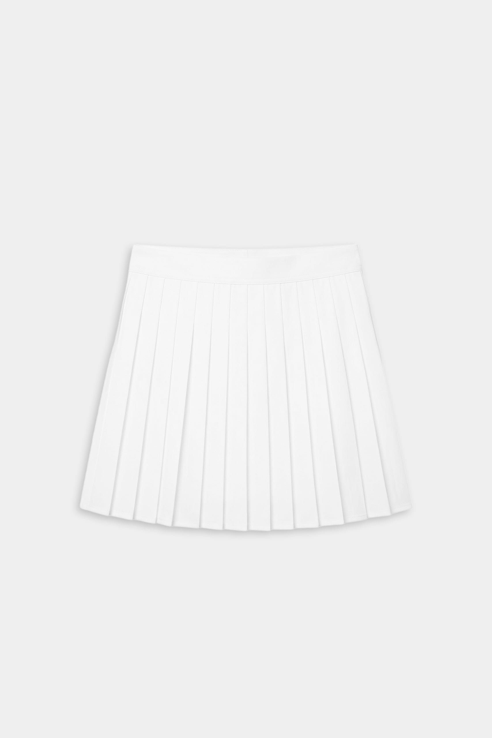 The SPLITS59 Shira Woven Pleated Skort in white is displayed flat on a light gray background, ideal for court sports or high-impact workouts.