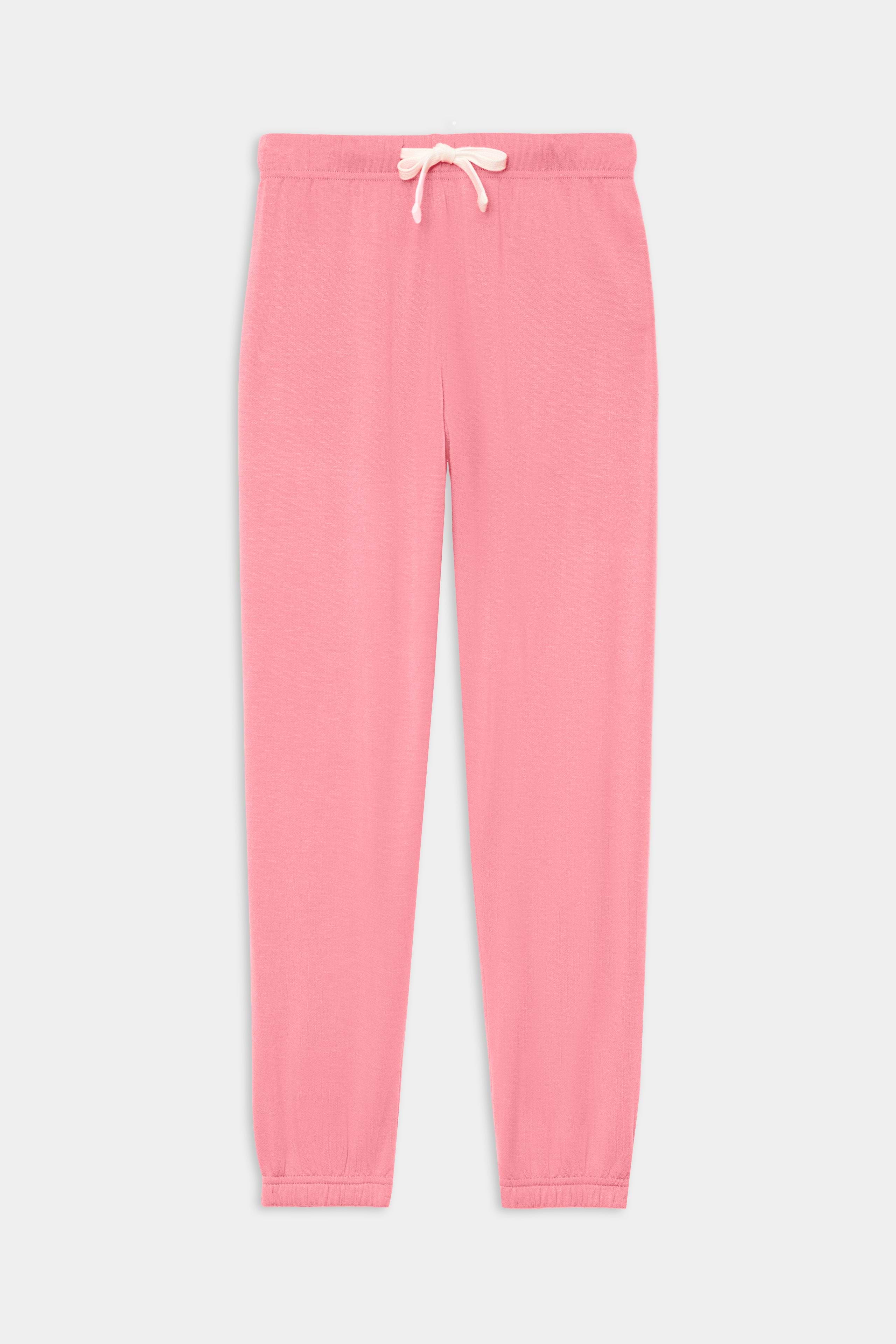 The SPLITS59 Sonja Fleece Sweatpant - Strawberry is a pink jogger with an elastic waistband, white drawstring, and elastic cuffs, crafted from ultra luxe fleece in Los Angeles for ultimate comfort. Shown laid flat on a white background.