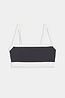The Monah Rigor Bra by SPLITS59 features a black and white colorblock design with white straps and trim, set against a plain white background.