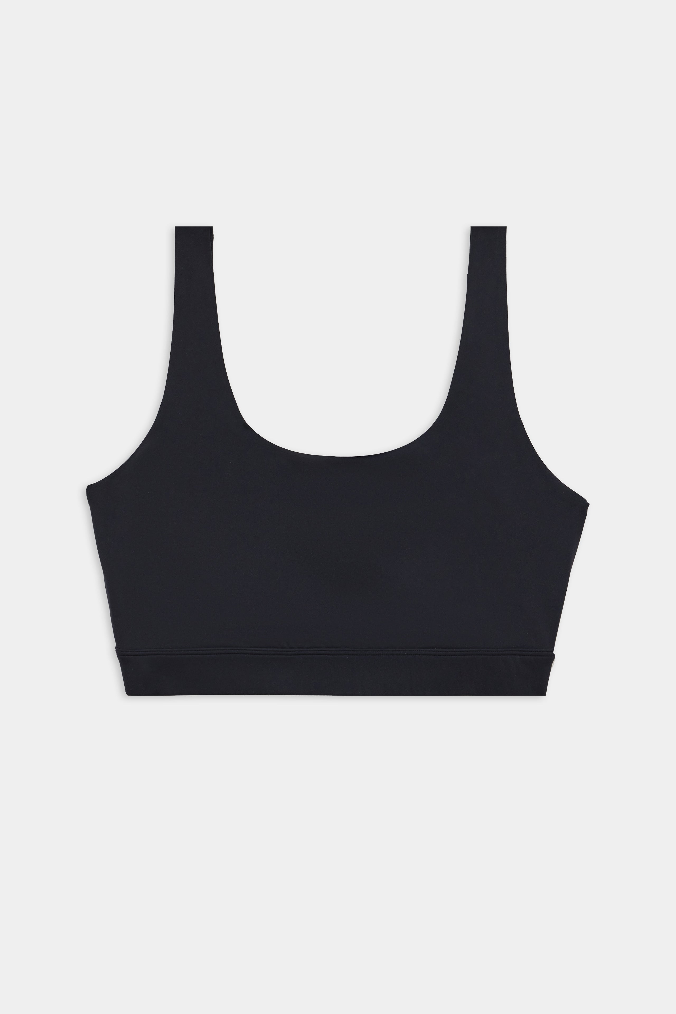 Black sports bra with wide straps and a scoop neckline, displayed flat against a white background.