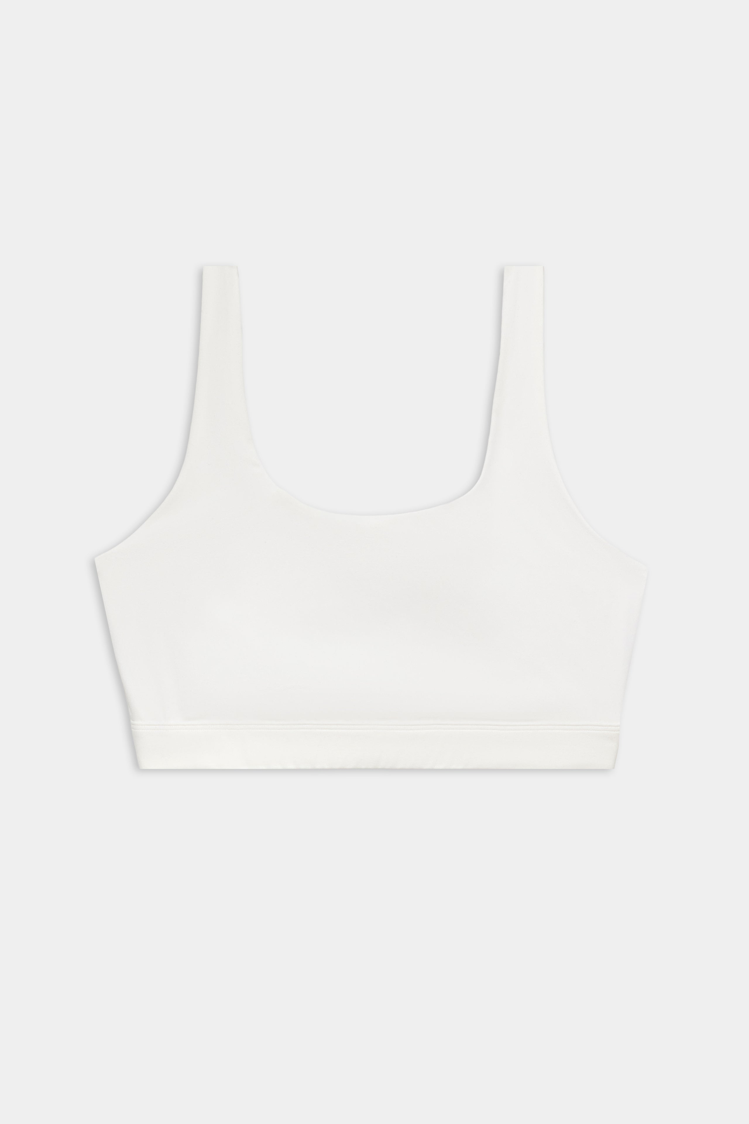 The SPLITS59 Sprint Rigor Bra - White is a sleeveless sports bra with a scoop neckline, perfect for gym workouts and multi-sport performance, showcased on a plain light background.