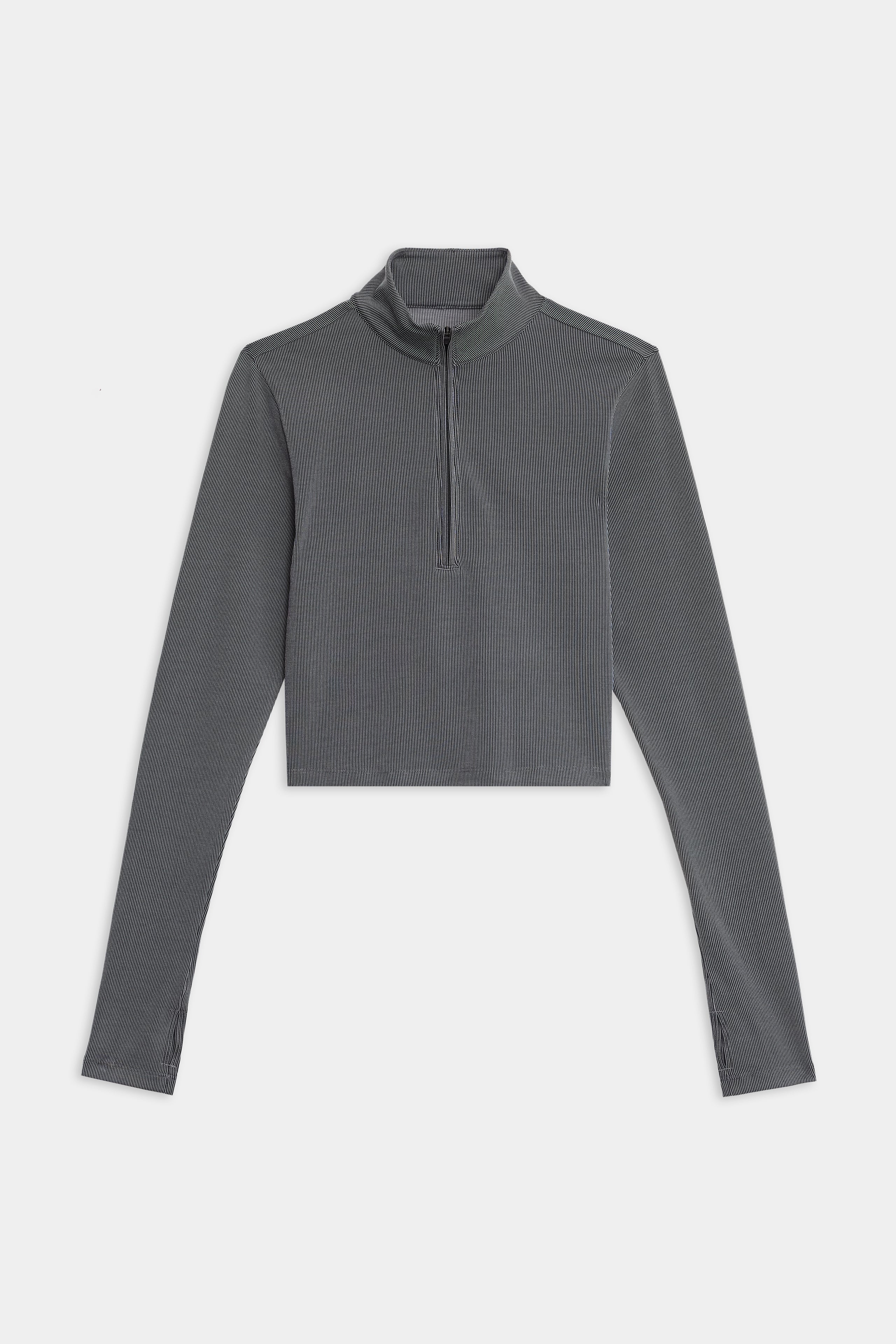 The Stevie Active Rib Half Zip by SPLITS59 is a gray long-sleeve crop top with a quarter-zip front and high collar, shown laid flat on a white background.