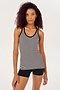 Front view of girl wearing a black and white stripe ribbed tank top and a black bike shorts