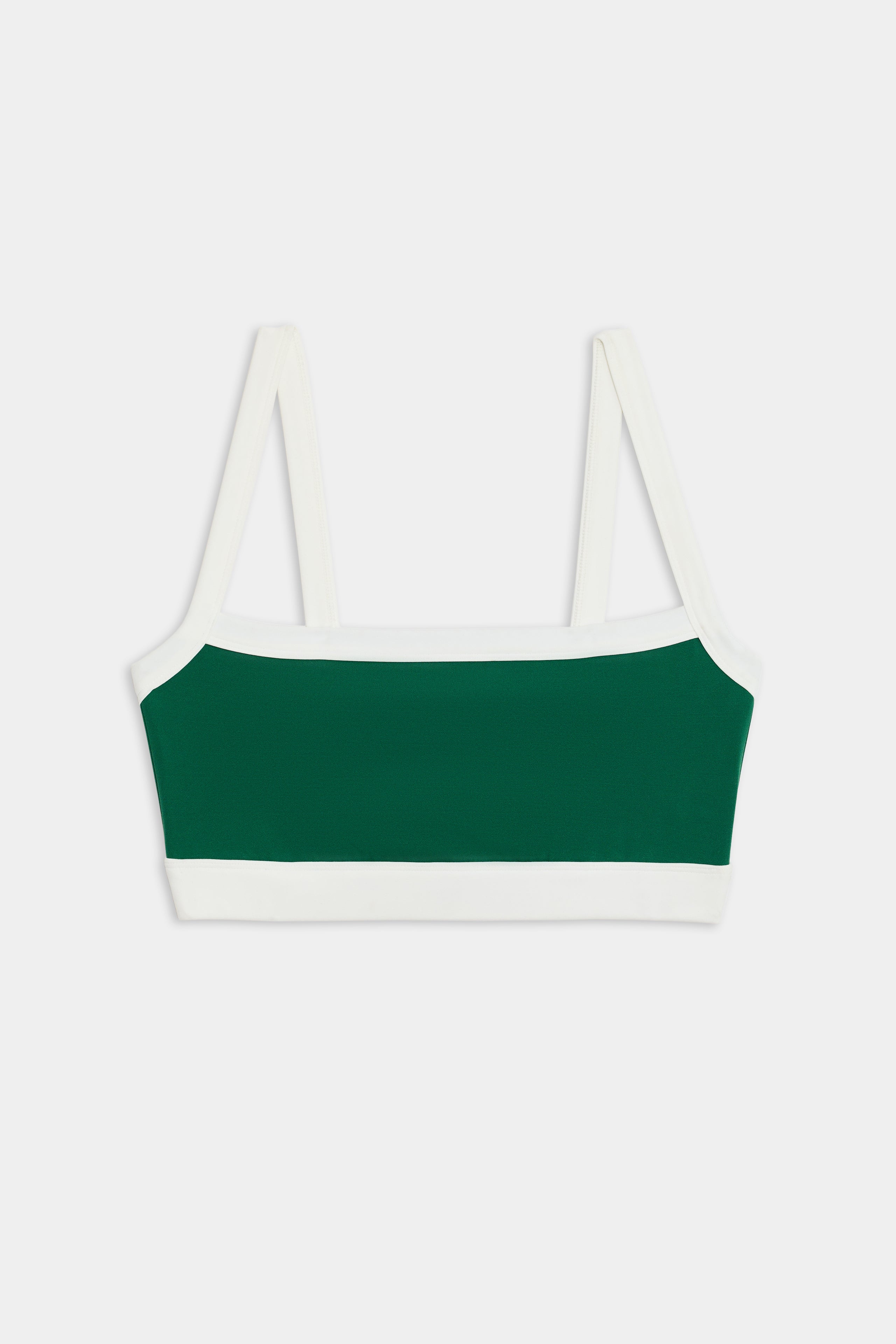 The SPLITS59 Monah Rigor Bra in Arugula/White is a green and white two-tone bralette with sleek white straps and trim, elegantly laid flat against a plain white background.