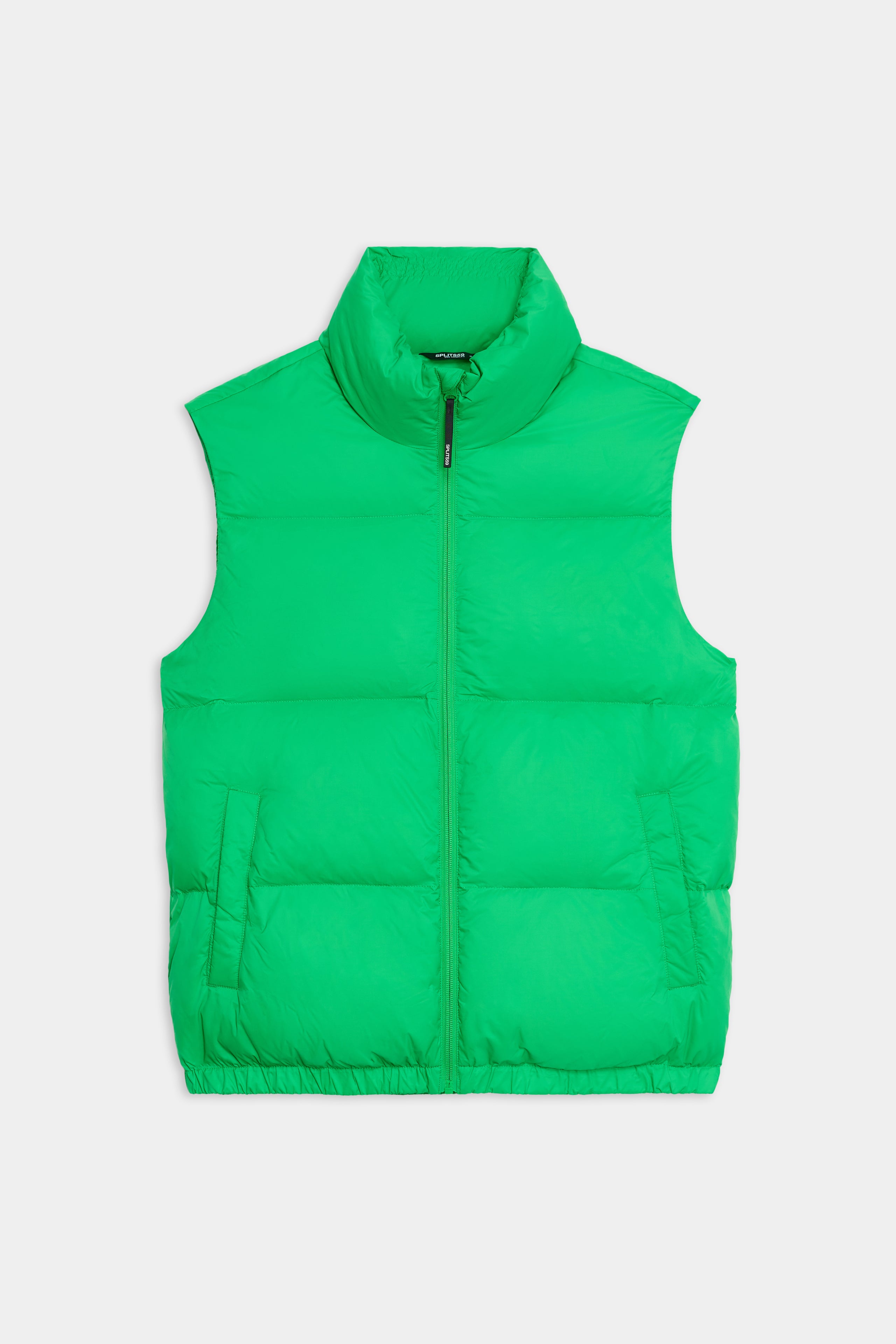 The SPLITS59 Summit Nylon Puffer Vest in Grass features lightweight insulation, a high collar, front zipper, and two side pockets—ideal for cool weather workouts. Shown laid flat on a white background.