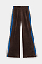 The SPLITS59 Heritage Velour Pant in Dark Chocolate/Classic Blue features blue and white side stripes, ankle length, a wide-leg silhouette, and is shown laid flat on a white background.