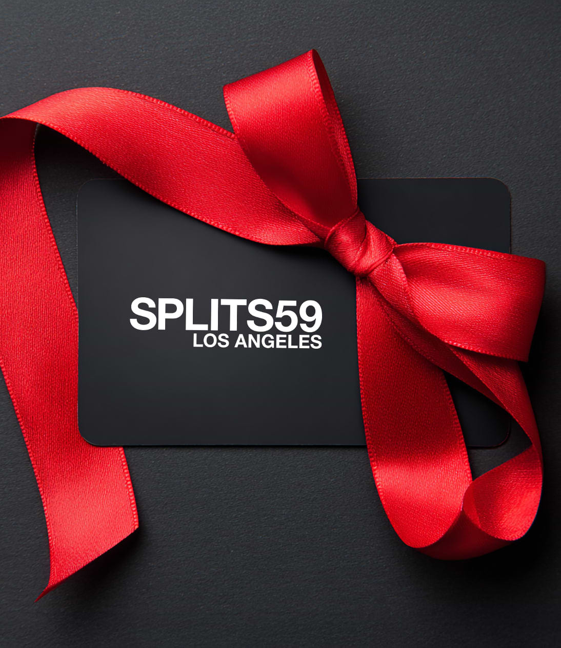 A Rise.ai Gift card displayed with a red satin ribbon bow on a dark background.