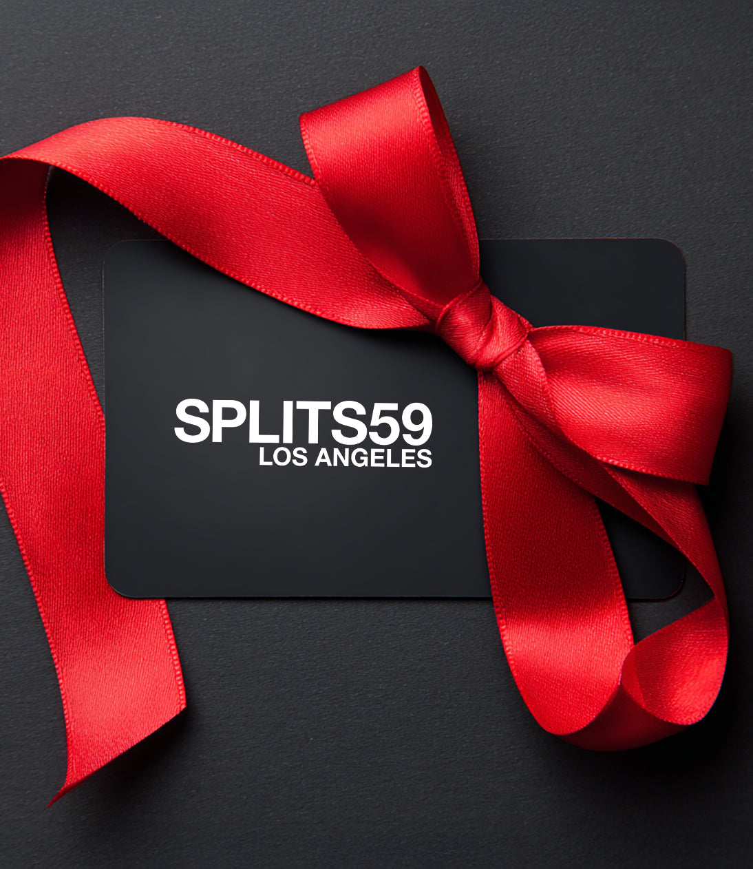 A Rise.ai Gift card displayed with a red satin ribbon bow on a dark background.