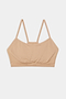 A Loren Seamless Bra in Nude on a white background from Splits59.