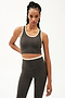 Front view of girl wearing cropped grey tank top with white trim and grey leggings with a thin white waistband