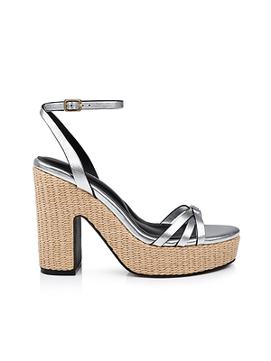 The Genevra Platform Sandal is a silver strappy high-heeled sandal in nappa leather with an ankle strap and buckle, featuring a thick woven block heel and platform with a basket-like texture.