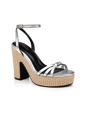 The Genevra Platform Sandal features a woven beige platform sole, metallic silver Nappa leather heels, a black inner sole, and an ankle strap with buckle, showcased on a white background.