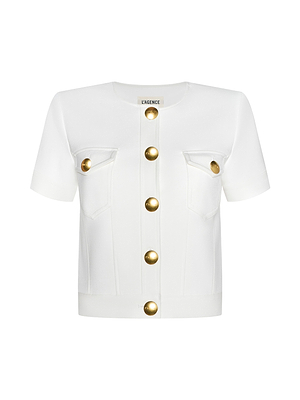 The Nawa Shirt Jacket is a collarless white jacket featuring tailored short sleeves, a round neckline, gold front buttons, and two chest pockets with matching gold accents in a structured, elegant fabric.
