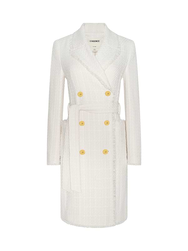 The Cooper Tweed Trench Coat is a white textured double-breasted jacket featuring long sleeves, gold buttons, frayed trims, a notched lapel collar, and a matching waist belt, showcased against a plain white background.