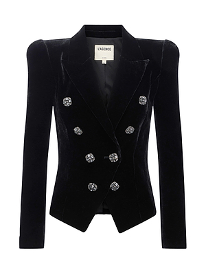 The Bethany Velvet Blazer by L'AGENCE is a black double-breasted blazer with structured shoulders and crystal-embellished buttons, shown on a white background. The inner label displays the brand name L'AGENCE.