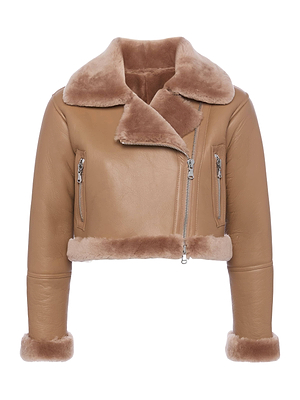 The Pike Shearling Leather Jacket features a cropped, boxy fit with a wide plush shearling collar, lamb shearling trim at the hem and cuffs, and an asymmetrical front zip closure with silver zippers on both sides.