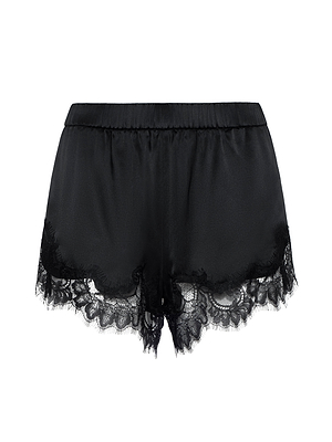 The Joy Silk Lace Short features black satin with an elastic waistband and delicate lace hem accents. Its smooth, shiny fabric offers a luxurious look, perfect for warm-weather sleepwear or lounging in style.