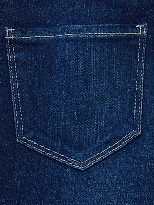 Close-up of blue stretch denim on the Alicent Wide-Leg Jean, featuring a back pocket with white stitching.