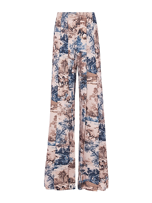 The Nova Pleated Wide-Leg Pant features a high rise and bold blue and beige Western toile print with countryside and nature illustrations on a white background.