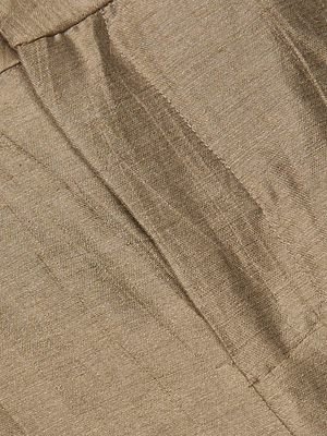 Close-up of the Allanah Linen-Blend Trouser in shiny gold, featuring visible stitching and gathers that highlight its smooth texture and reflective surface—ideal for a modern, flattering fit.