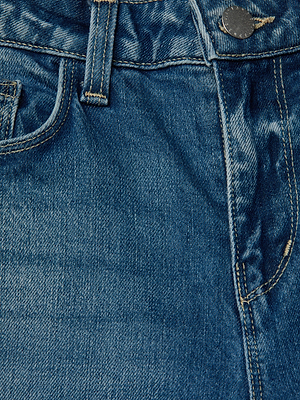 Close-up of the Marguerite Skinny Jean in blue stretch denim, featuring the waistband, metal button, belt loop, front pocket, and visible stitching detail.