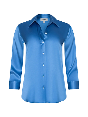 The Dani Silk Blouse is a long-sleeve, collared button-down shirt in regatta blue satin, shown on a white background.