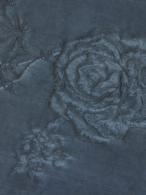 Close-up of dark blue floral jacquard fabric with a large rose and textured details—ideal for creating the Rhett Oversized Blouse or a chic bohemian top.