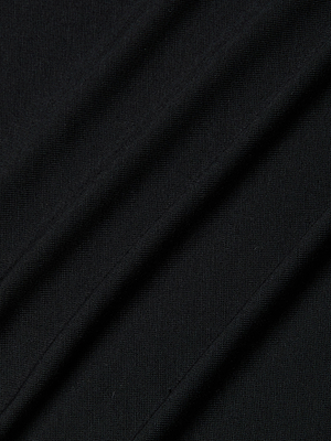Close-up of the black micro modal fabric used in the Remy Tee, featuring diagonal folds and a fine, textured weave. The soft surface with visible stitching makes it ideal for a relaxed fit or lightweight jersey garment.