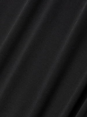 Close-up of black poly georgette fabric with subtle diagonal folds and soft texture, highlighting the fine weave—perfect for the Raye Slip Lining Dress with adjustable straps.