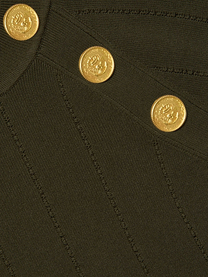 Close-up of the Gretchen Pullover by L'AGENCE in dark olive green ribbed knit, featuring three gold crest-embossed decorative buttons arranged diagonally.