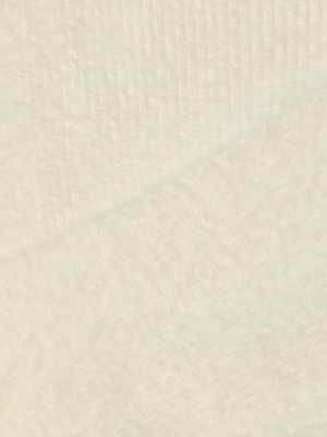 Close-up of the Antonella Crossover Sweater shows its fuzzy ivory knit with subtle diagonal lines and a soft surface, evoking warmth and comfort.