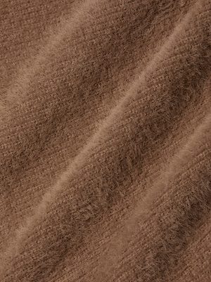 Close-up of the ultra-soft, textured knit fabric with diagonal ridges on the Guinevere Cropped Pullover, highlighting its warmth and cozy crewneck comfort.